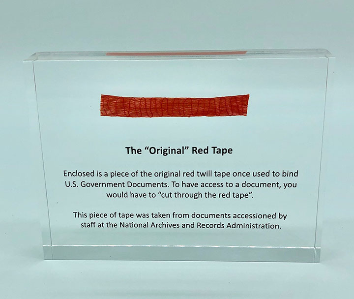 Red Tape Paperweight